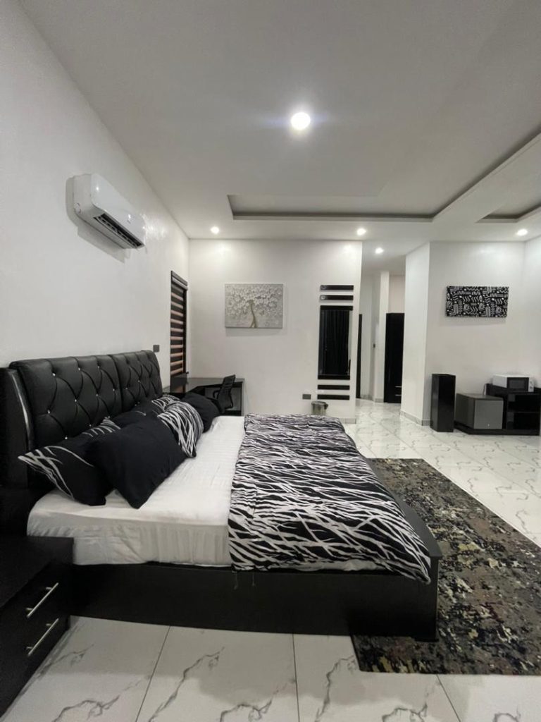 Spacious executive bedroom suite with premium linens at Privé Sphere, Lagos.